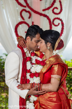 Indian bride and groom hugging Indian bride and groom hugging