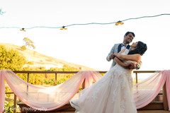 Indian bride and groom posing for pictures Indian bride and groom posing for pictures