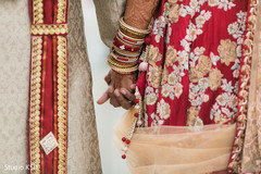 Closeup capture of Indian bride and groom holding hands. Closeup capture of Indian bride and groom holding hands.