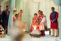 Indian couple making offerings to sacred fire. Indian couple making offerings to sacred fire.