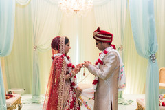 Indian groom putting ring to bride capture. Indian groom putting ring to bride capture.