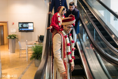 Indian groom and bride walking out of ceremony capture. Indian groom and bride walking out of ceremony capture.