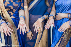 Indian bridesmaids showing their mehndi designs Indian bridesmaids showing their mehndi designs