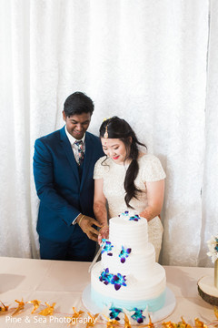 Indian couple ready to slice their cake Indian couple ready to slice their cake