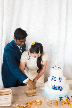 Indian couple during cake cutting moment Indian couple during cake cutting moment