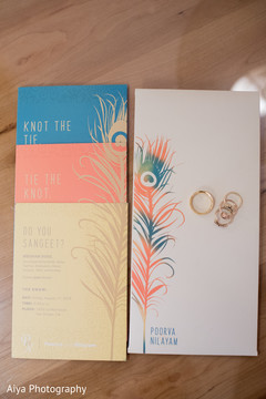Elegant Indian wedding invitations and wedding rings. Elegant Indian wedding invitations and wedding rings.