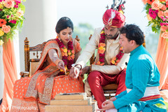 Indian couple making offerings to sacred fire Indian couple making offerings to sacred fire