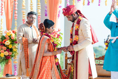Indian groom putting wedding ring to bride. Indian groom putting wedding ring to bride.