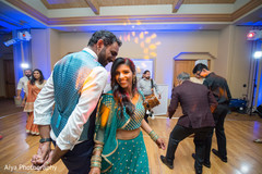 Upbeat Indian couple and guest dance performance. Upbeat Indian couple and guest dance performance.