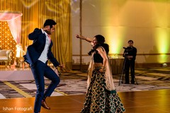 Joyful Indian bride and groom at dance performance capture. Joyful Indian bride and groom at dance performance capture.