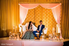 Charming Indian bride and groom enjoying wedding reception. Charming Indian bride and groom enjoying wedding reception.