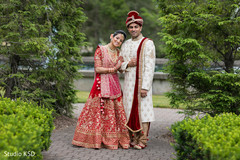 Indian bride and groom posing for pictures Indian bride and groom posing for pictures