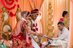 Indian bride and groom during rituals Indian bride and groom during rituals
