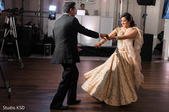 Indian bride and groom having their first dance Indian bride and groom having their first dance