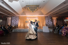 Indian bride and groom having a dance Indian bride and groom having a dance