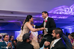 Indian bride and groom having a great time dancing Indian bride and groom having a great time dancing