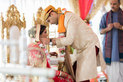 Indian groom putting chain to bride. Indian groom putting chain to bride.