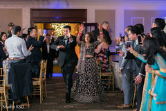 Indian newlyweds making their entrance to wedding reception Indian newlyweds making their entrance to wedding reception