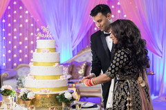 Indian wedding cutting the cake scene. Indian wedding cutting the cake scene.