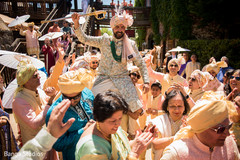 Indian groom lifted by groomsmen at baraat procession. Indian groom lifted by groomsmen at baraat procession.