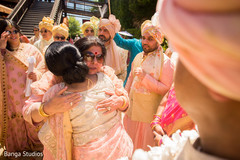 Indian bride and groom's relatives at milni celebration. Indian bride and groom's relatives at milni celebration.