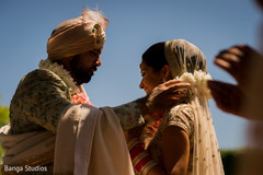 Indian groom putting garland to bride. Indian groom putting garland to bride.