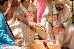 Indian couple pouring oil to sacred fire ritual. Indian couple pouring oil to sacred fire ritual.