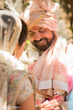 Indian groom putting ring to bride. Indian groom putting ring to bride.