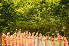indian couple posing with bridesmaids and groomsmen. indian couple posing with bridesmaids and groomsmen.