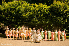 Indian couple posing outdoors with bridesmaids and agroomsmen. Indian couple posing outdoors with bridesmaids and agroomsmen.