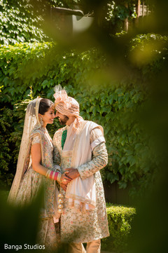 indian bride and groom looking at each other capture. indian bride and groom looking at each other capture.