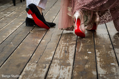 Indian bride red sole wedding shoes and groom's mojaris. Indian bride red sole wedding shoes and groom's mojaris.