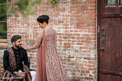 Indian bride and groom on their Smoky Pink reception outfits. Indian bride and groom on their Smoky Pink reception outfits.
