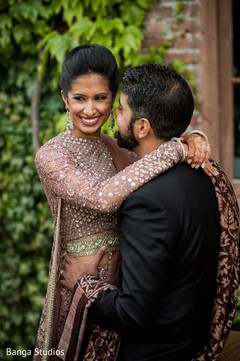 Indian bride and groom posing for reception photo shoot. Indian bride and groom posing for reception photo shoot.
