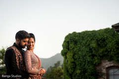 Indian couple posing outdoors for photo shoot. Indian couple posing outdoors for photo shoot.