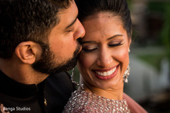 Indian groom kissing bride. Indian groom kissing bride.