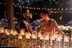Indian couple posing at reception stage for photo shoot. Indian couple posing at reception stage for photo shoot.