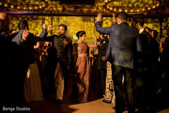 Indian bride and groom leaving reception party. Indian bride and groom leaving reception party.