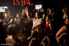 Indian bride with wedding guests dancing. Indian bride with wedding guests dancing.