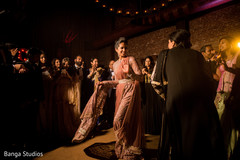 Indian bride dancing with relative at reception party. Indian bride dancing with relative at reception party.