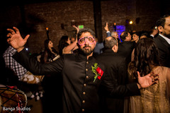 Indian groom dancing at reception party capture. Indian groom dancing at reception party capture.