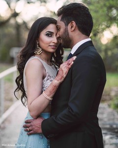 Elegant Indian bride and groom's reception look. Elegant Indian bride and groom's reception look.