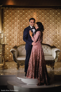 Elegant Indian couple on their reception outfits. Elegant Indian couple on their reception outfits.