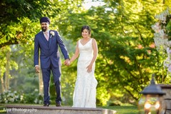 Indian bride and groom holding hands Indian bride and groom holding hands