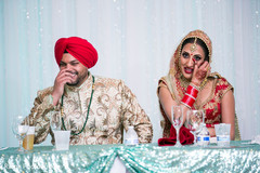 Indian couple listening to wedding speech Indian couple listening to wedding speech
