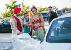 Indian bride getting in their vidaai car Indian bride getting in their vidaai car