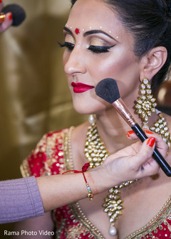 Indian bride getting her makeup done Indian bride getting her makeup done
