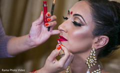 Indian bridal makeup artist at work Indian bridal makeup artist at work