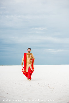 Indian groom walking outdoors for pictures Indian groom walking outdoors for pictures