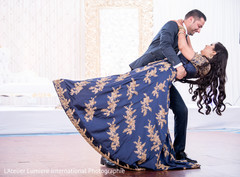 Indian bride and groom dancing during the reception Indian bride and groom dancing during the reception